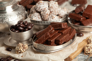 Festive Happy New Year's table full of chocolates. Assortment of delicious chocolate candies background