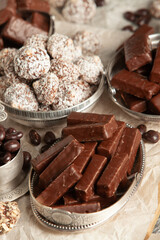 Festive Happy New Year's table full of chocolates. Assortment of delicious chocolate candies background