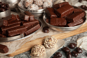Festive Happy New Year's table full of chocolates. Assortment of delicious chocolate candies background