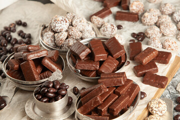 Festive Happy New Year's table full of chocolates. Assortment of delicious chocolate candies background