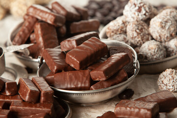 Festive Happy New Year's table full of chocolates. Assortment of delicious chocolate candies background