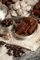 Festive Happy New Year's table full of chocolates. Assortment of delicious chocolate candies background