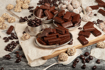 Festive Happy New Year's table full of chocolates. Assortment of delicious chocolate candies background