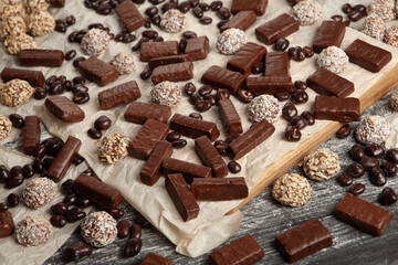 Festive Happy New Year's table full of chocolates. Assortment of delicious chocolate candies background