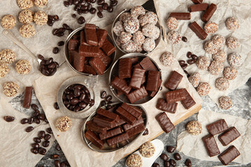 Festive Happy New Year's table full of chocolates. Assortment of delicious chocolate candies background