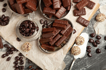 Festive Happy New Year's table full of chocolates. Assortment of delicious chocolate candies background