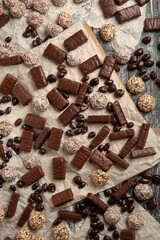 Festive Happy New Year's table full of chocolates. Assortment of delicious chocolate candies background