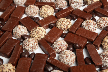Festive Happy New Year's table full of chocolates. Assortment of delicious chocolate candies background