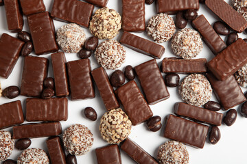 Festive Happy New Year's table full of chocolates. Assortment of delicious chocolate candies background