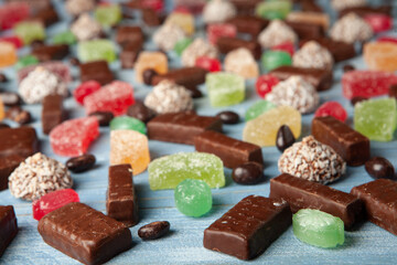 Festive Happy New Year's table full of chocolates. Assortment of delicious chocolate candies background