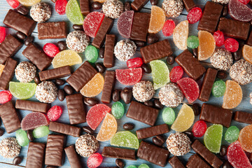 Festive Happy New Year's table full of chocolates. Assortment of delicious chocolate candies background