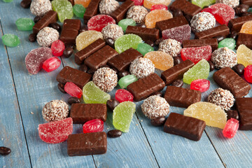 Festive Happy New Year's table full of chocolates. Assortment of delicious chocolate candies background