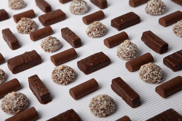 Festive Happy New Year's table full of chocolates. Assortment of delicious chocolate candies background