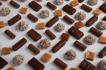 Festive Happy New Year's table full of chocolates. Assortment of delicious chocolate candies background