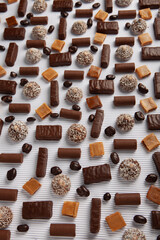 Festive Happy New Year's table full of chocolates. Assortment of delicious chocolate candies background