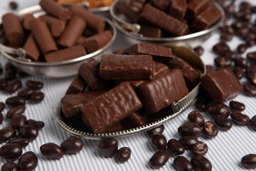 Festive Happy New Year's table full of chocolates. Assortment of delicious chocolate candies background