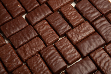 Festive Happy New Year's table full of chocolates. Assortment of delicious chocolate candies background