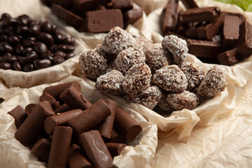 Festive Happy New Year's table full of chocolates. Assortment of delicious chocolate candies background