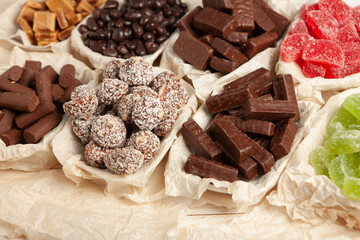 Festive Happy New Year's table full of chocolates. Assortment of delicious chocolate candies background