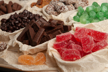 Festive Happy New Year's table full of chocolates. Assortment of delicious chocolate candies background