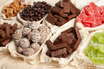 Festive Happy New Year's table full of chocolates. Assortment of delicious chocolate candies background