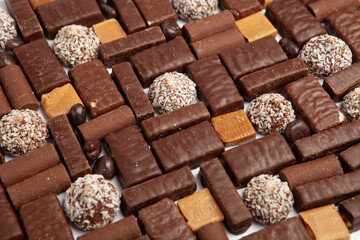 Festive Happy New Year's table full of chocolates. Assortment of delicious chocolate candies background