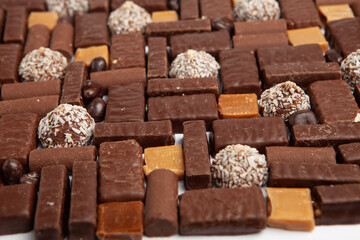 Festive Happy New Year's table full of chocolates. Assortment of delicious chocolate candies background