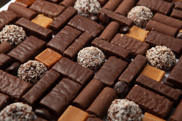 Festive Happy New Year's table full of chocolates. Assortment of delicious chocolate candies background