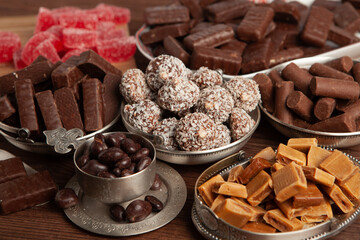 Festive Happy New Year's table full of chocolates. Assortment of delicious chocolate candies background