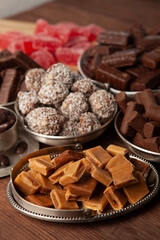 Festive Happy New Year's table full of chocolates. Assortment of delicious chocolate candies background