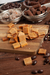 Festive Happy New Year's table full of chocolates. Assortment of delicious chocolate candies background