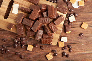 Festive Happy New Year's table full of chocolates. Assortment of delicious chocolate candies background