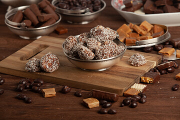 Festive Happy New Year's table full of chocolates. Assortment of delicious chocolate candies background