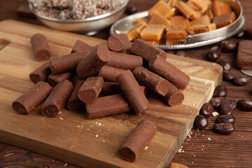 Festive Happy New Year's table full of chocolates. Assortment of delicious chocolate candies background