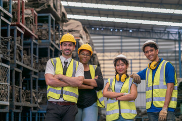 Fototapeta na wymiar Group of technicians or foreman. Team of workers and engineer in parts warehouse. Space for Text.