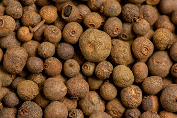 Allspice spice background. Natural seasoning texture close up