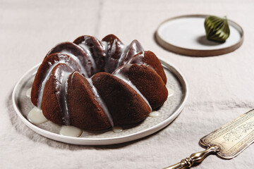 Pumpkin tangerine bundt cake with pumpkin spice and nuts for winter dinner. Christmas. Selective focus