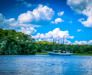 Sailing ship on the lake in the summer