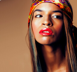 beauty bright real african woman with creative make up, shawl on head like cubian closeup smiling