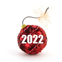 Christmas tree decoration. Red bomb ready to go off with golden sparkles on white background. New...