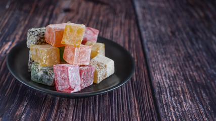 Turkish delight on a dark wood background