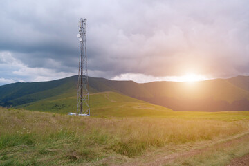 Cell tower and storm clouds in the mountains