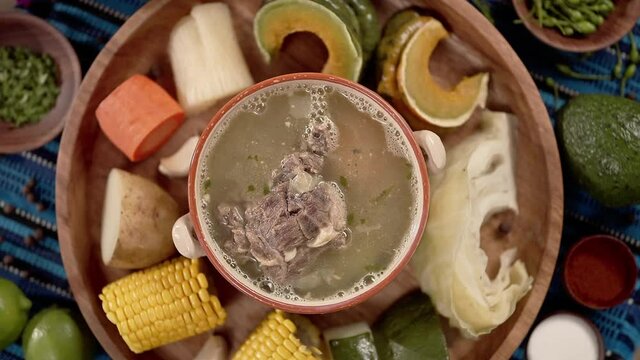 Caldo de res, a traditional Guatemalan dish, is made with meat and vegetables. 