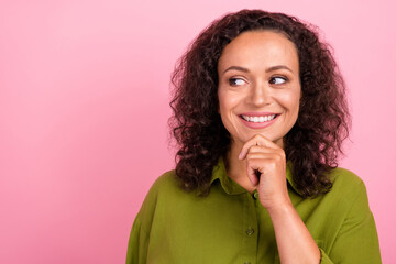 Fototapeta na wymiar Photo of dreamy nice positive happy afro amarican woman good mood look empty space isolated on pastel pink color background