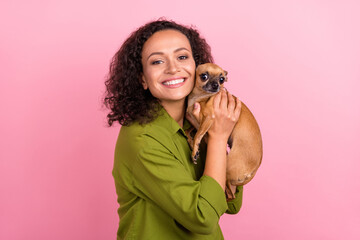 Photo of positive charming cheerful young happy afro american woman hold dog good mood hug isolated...