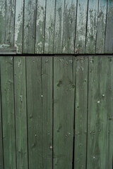 Background and texture of old wooden boards with remnants of paint.
