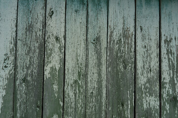 Background and texture of old wooden boards with remnants of paint.