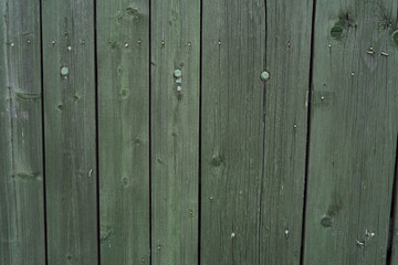 Background and texture of old wooden boards with remnants of paint.