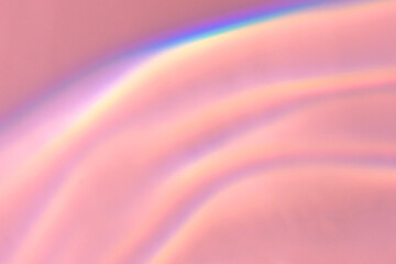 Obraz premium Beautiful lights and shadows of glass on pink or purple background. Overlay mode. Caustic effect of light. Sun hard reflection. Shadows texture. Blurred water backdrop. Top view. Trendy concept