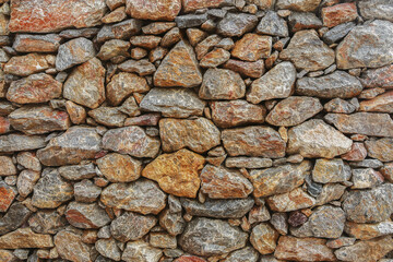various layered hard stones and rock background